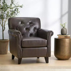 Fauteuil club contemporain capitonné en cuir reconstitué avec accoudoirs arrondis